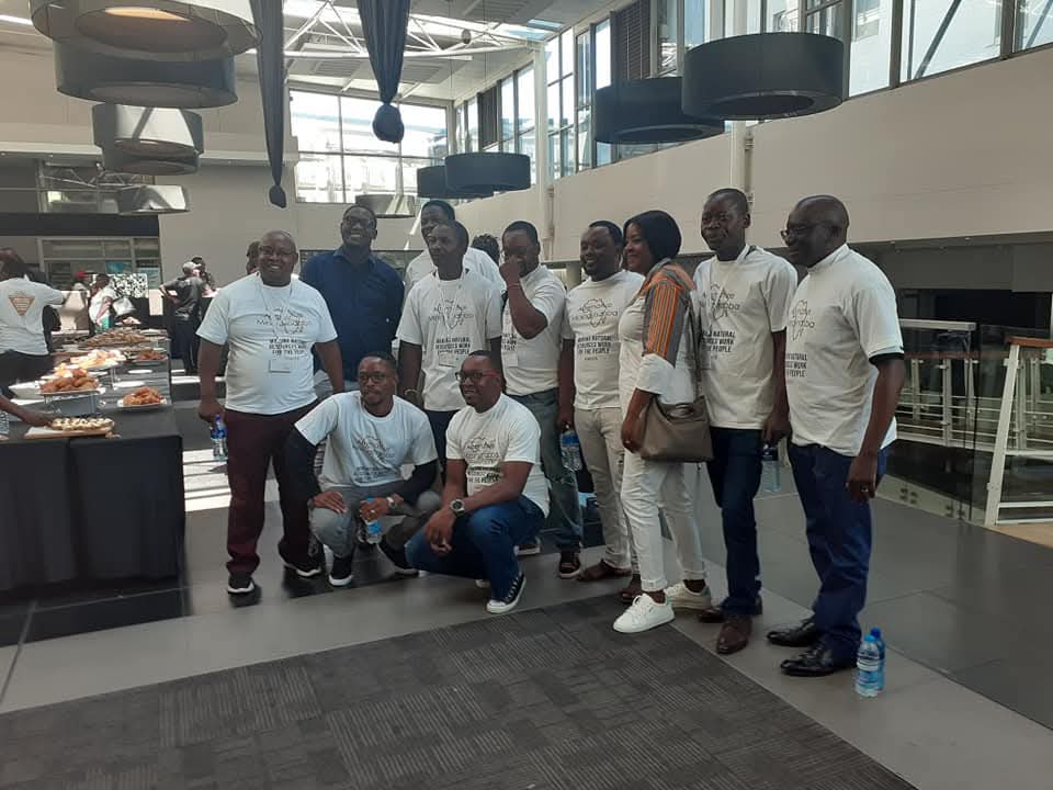PIC Zambia team in branded t-shirts at a civic advocacy event